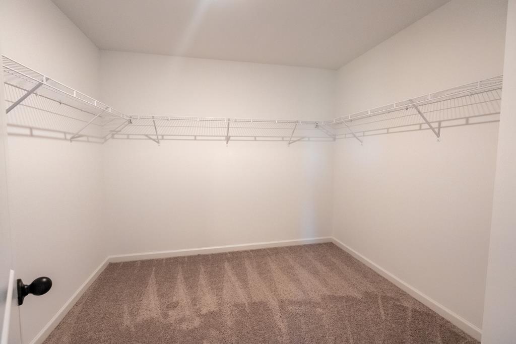 42 Hawkeye Trail Fortson, GA 31808 - Photo 24 of 29 a view of a room with racks on the wall