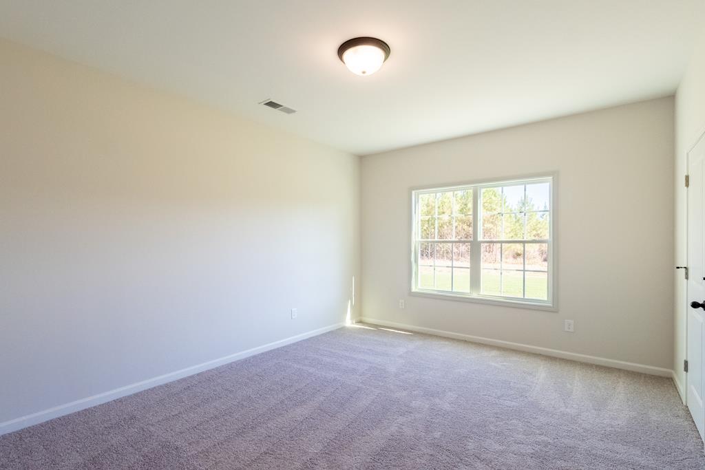 42 Hawkeye Trail Fortson, GA 31808 - Photo 10 of 29 an empty room with a window
