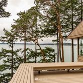a view of a patio with table and chairs and potted plants
