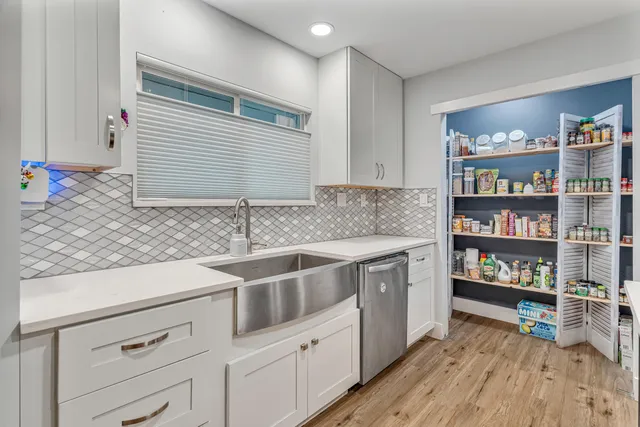 a kitchen with stainless steel appliances granite countertop a stove and a microwave