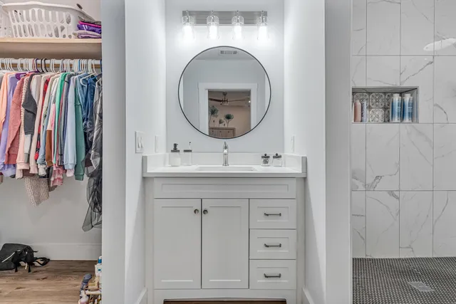 a view of front door with furniture and a floor to ceiling window