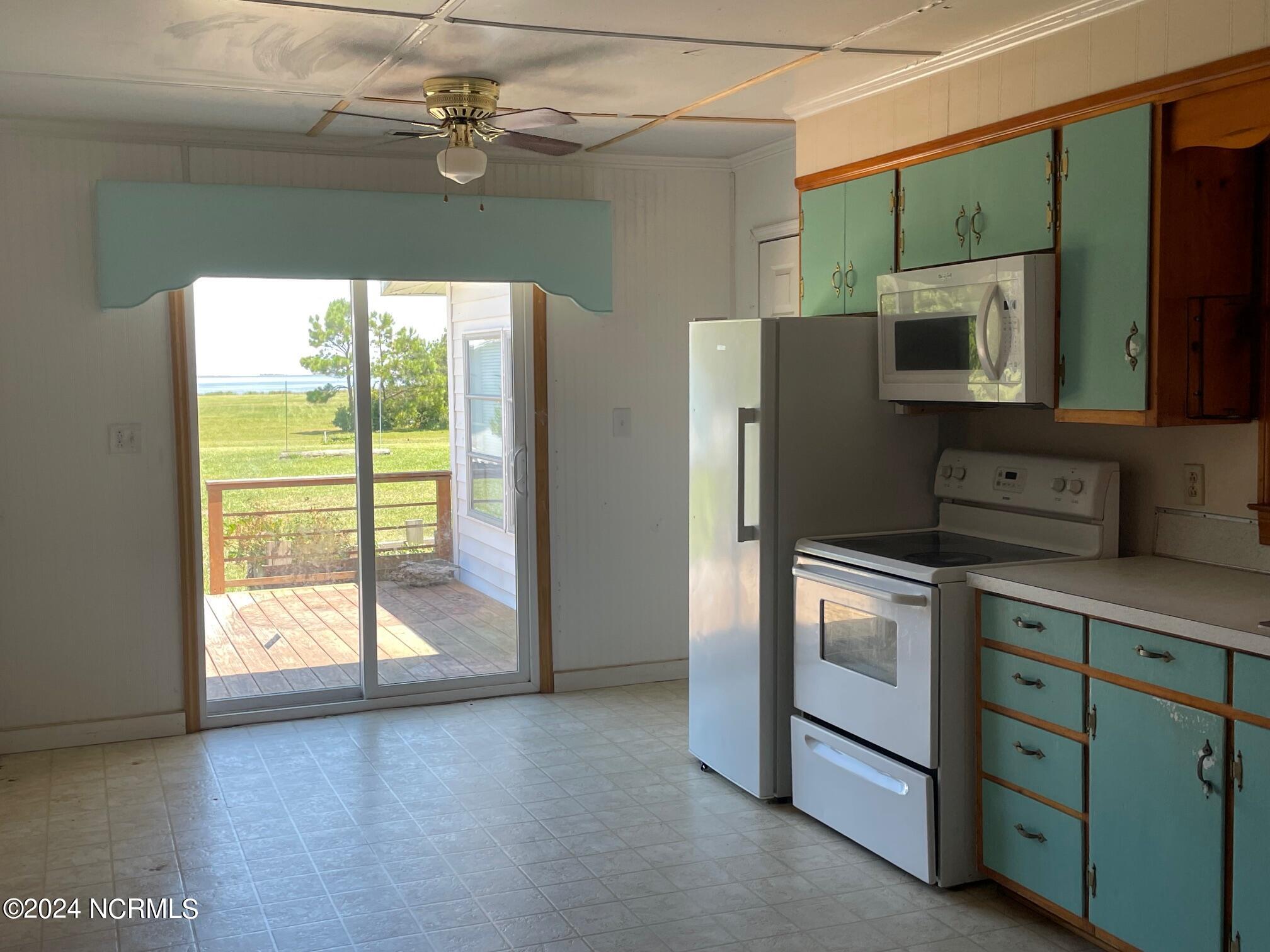 2604 Cedar Island Road Cedar Island, NC 28520 - Photo 26 of 62 Glassing doors face waterfront