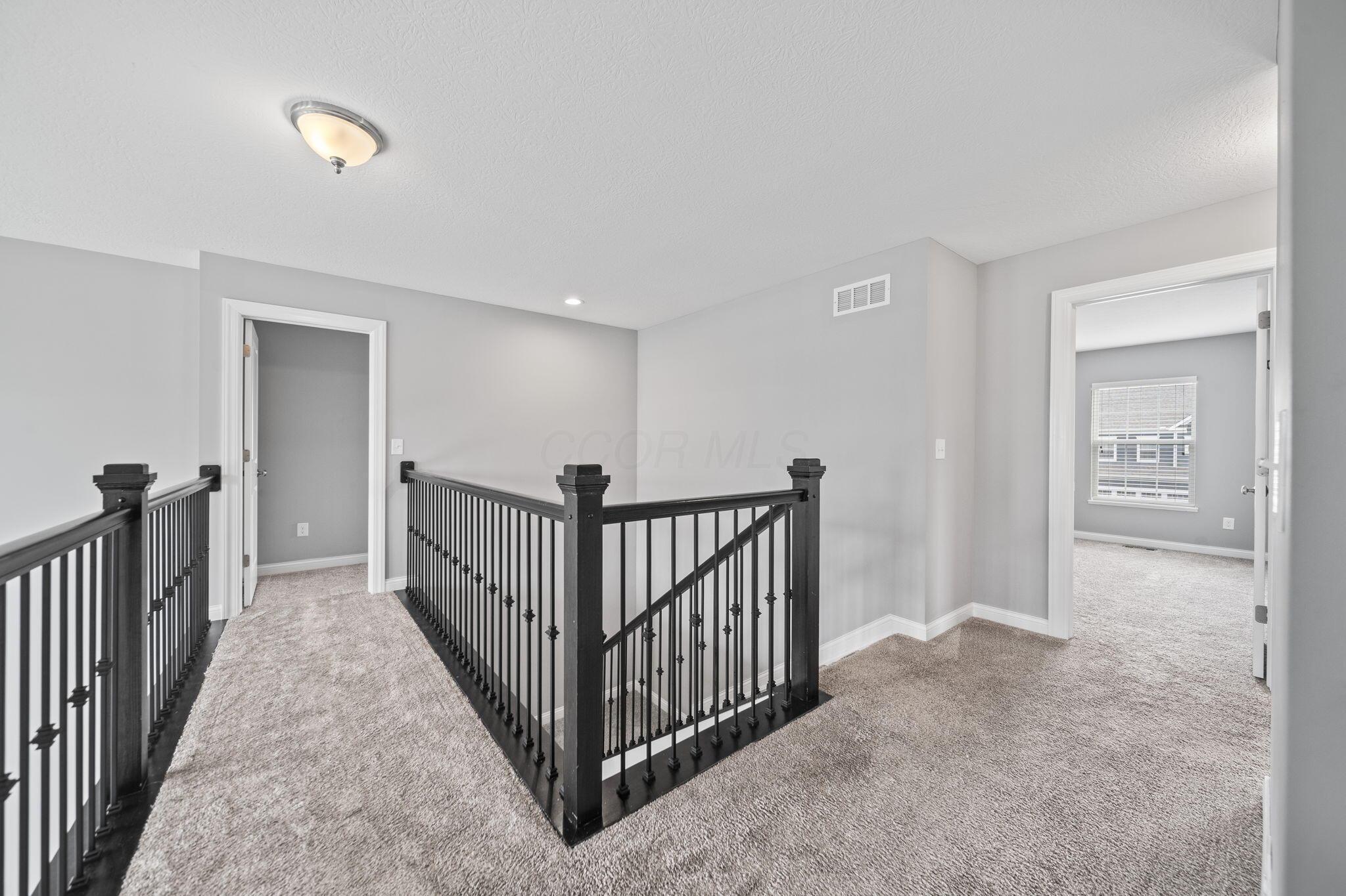 6158 Heather Ridge Drive Delaware, OH 43015 - Photo 26 of 51 2nd floor walkway to Primary Suite