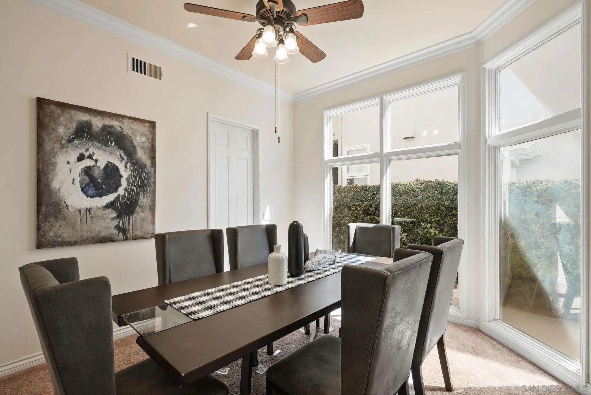 9683 Claiborne Square La Jolla, CA 92037 - Photo 11 of 67 a living room with furniture and a large window