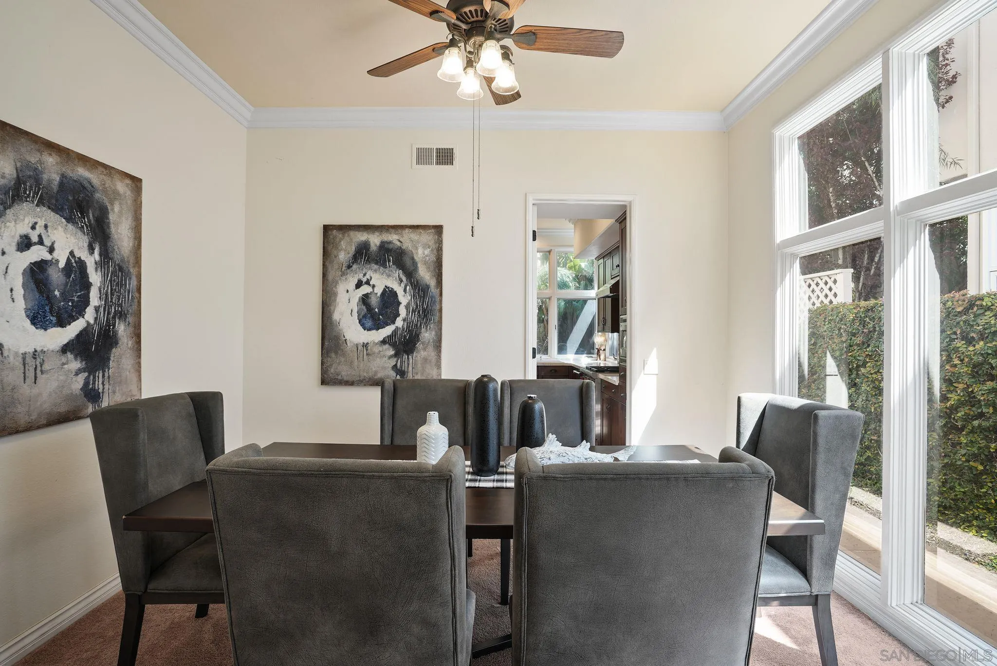 9683 Claiborne Square La Jolla, CA 92037 - Photo 13 of 67 a dining room with furniture and window