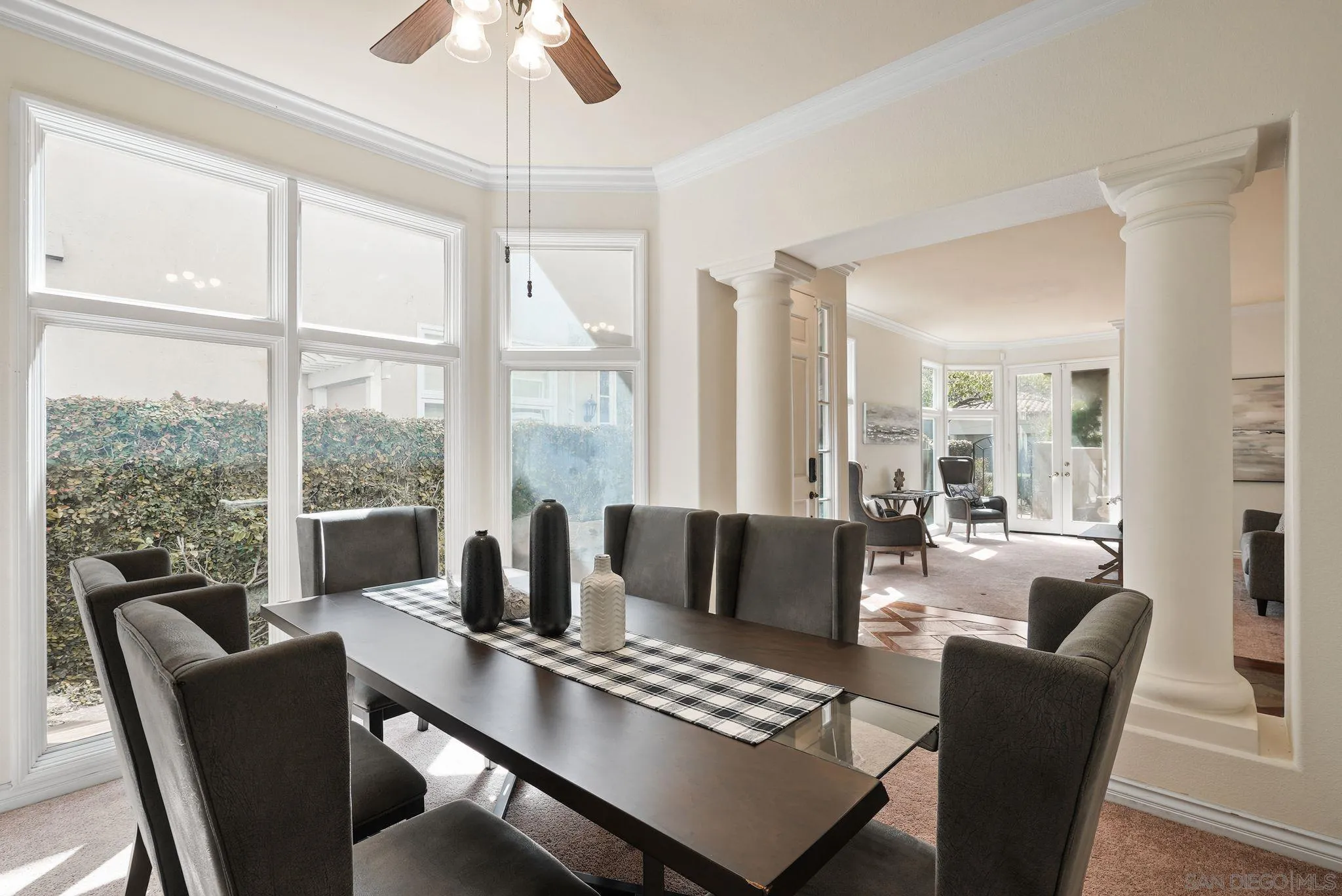 9683 Claiborne Square La Jolla, CA 92037 - Photo 14 of 67 a view of a dining room with furniture window and outside view