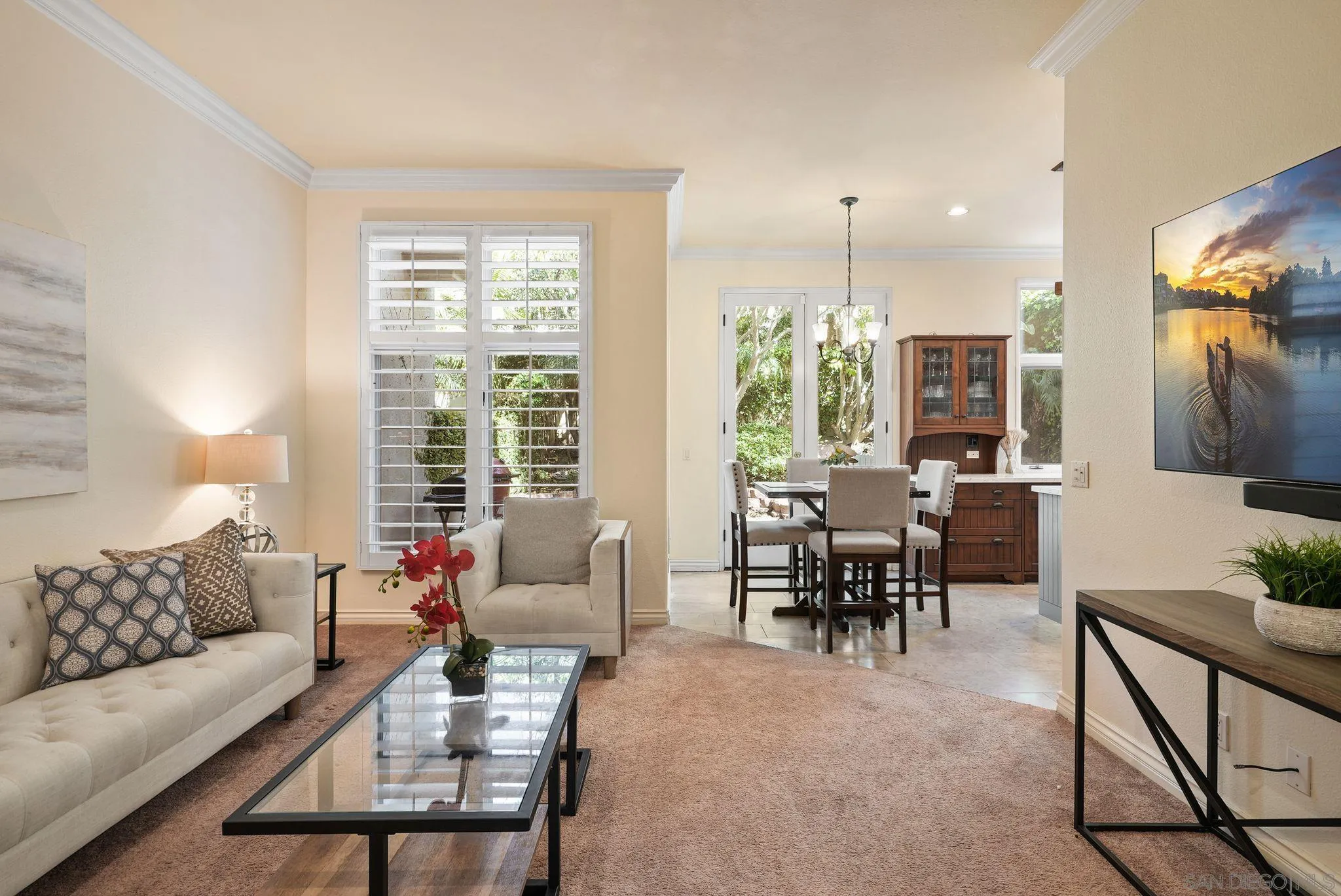 9683 Claiborne Square La Jolla, CA 92037 - Photo 16 of 67 a living room with furniture and a large window