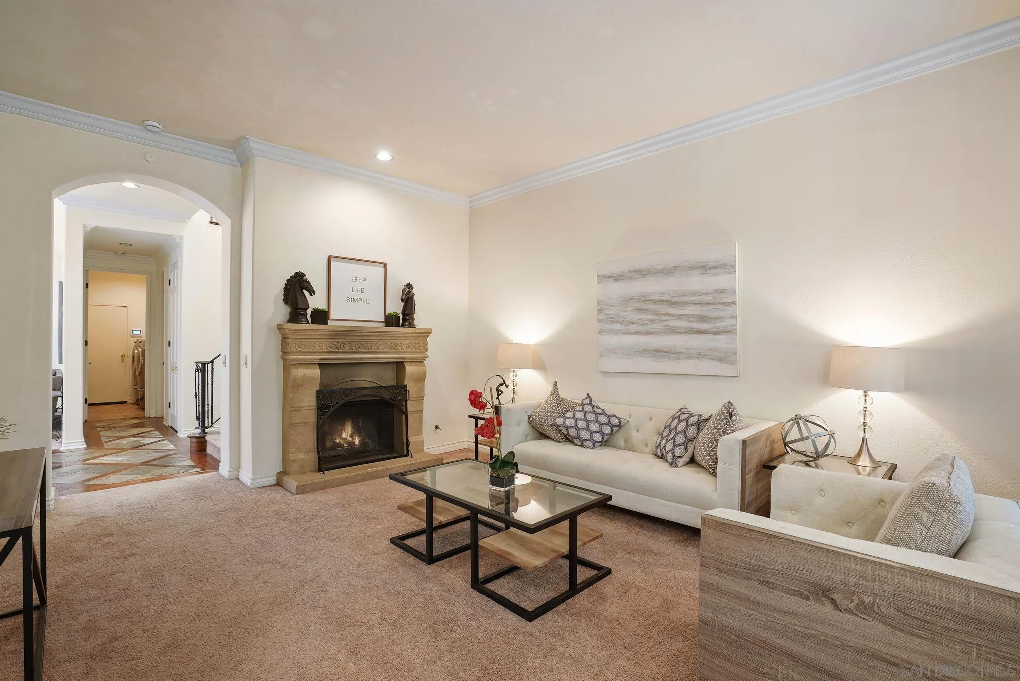 9683 Claiborne Square La Jolla, CA 92037 - Photo 18 of 67 a living room with furniture and a fireplace