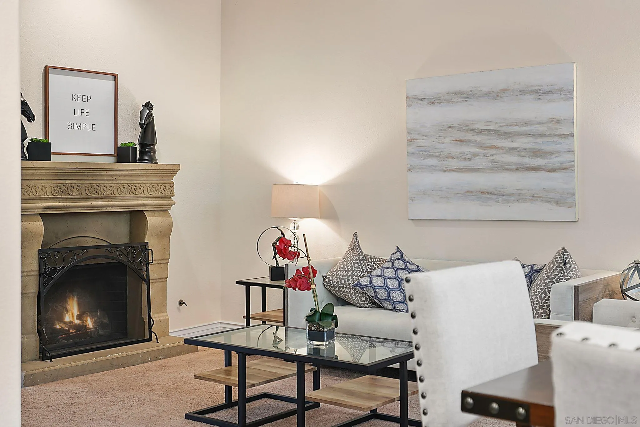 9683 Claiborne Square La Jolla, CA 92037 - Photo 19 of 67 a living room with furniture and a fireplace