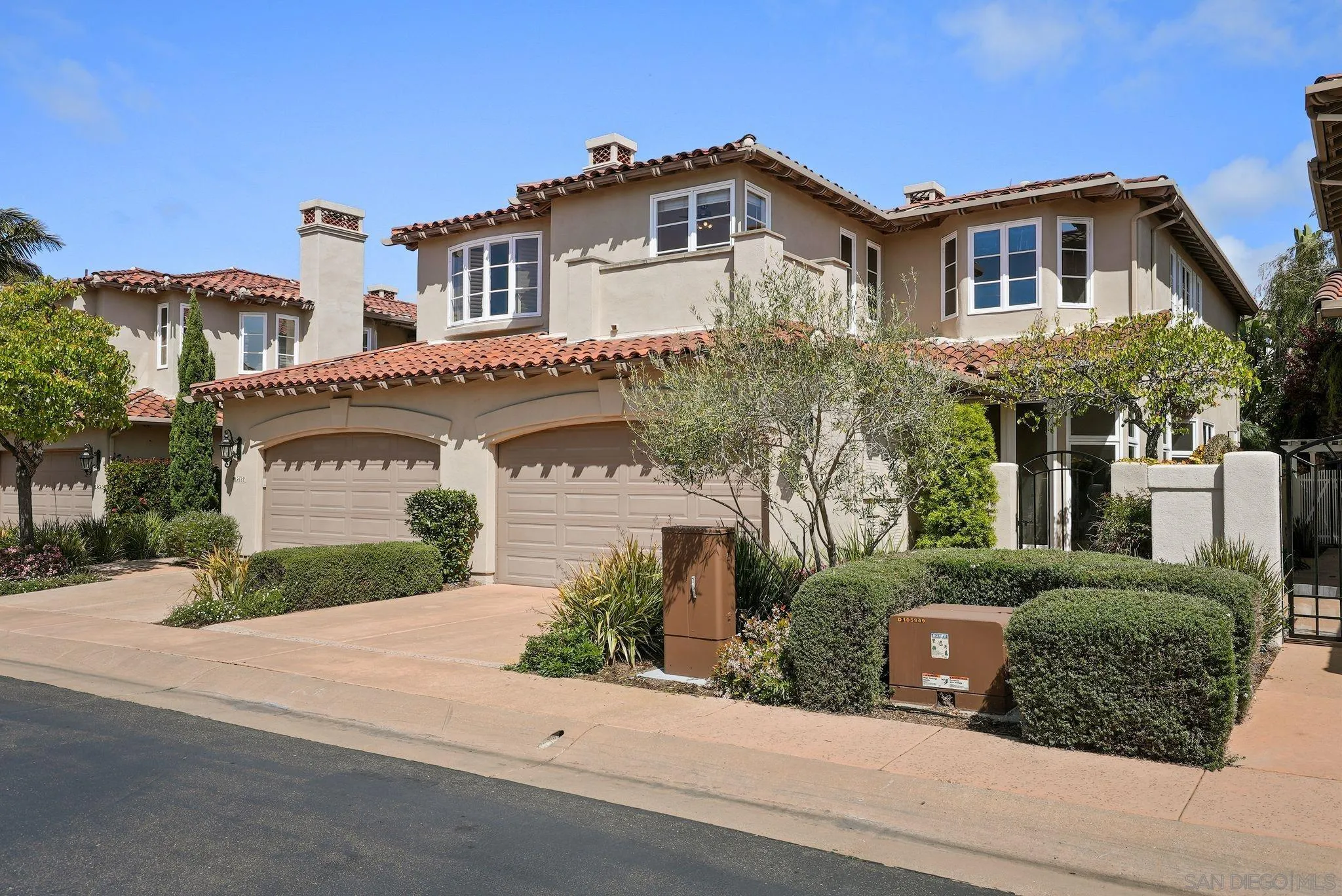 9683 Claiborne Square La Jolla, CA 92037 - Photo 3 of 67 front view of a house with a yard