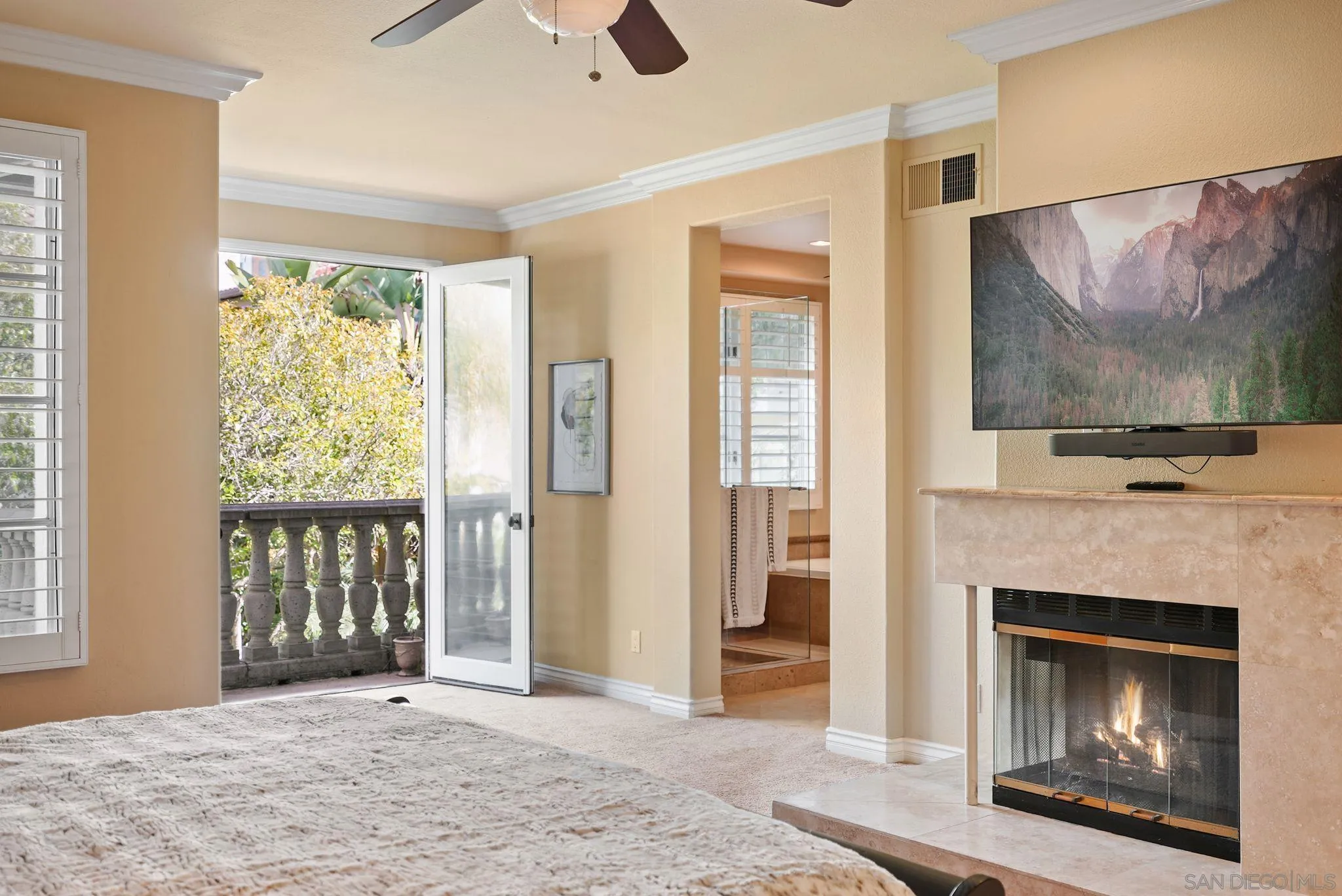 9683 Claiborne Square La Jolla, CA 92037 - Photo 32 of 67 a view of a livingroom with a fireplace and window