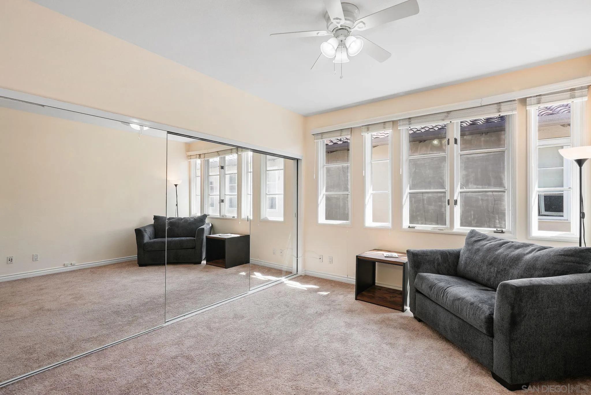 9683 Claiborne Square La Jolla, CA 92037 - Photo 42 of 67 a living room with furniture and windows