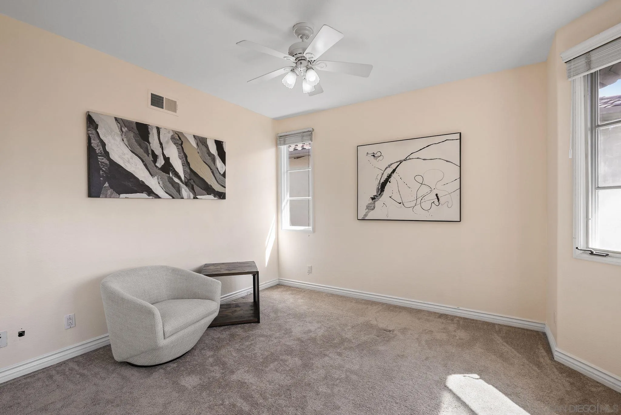 9683 Claiborne Square La Jolla, CA 92037 - Photo 43 of 67 a living room with furniture and a chandelier