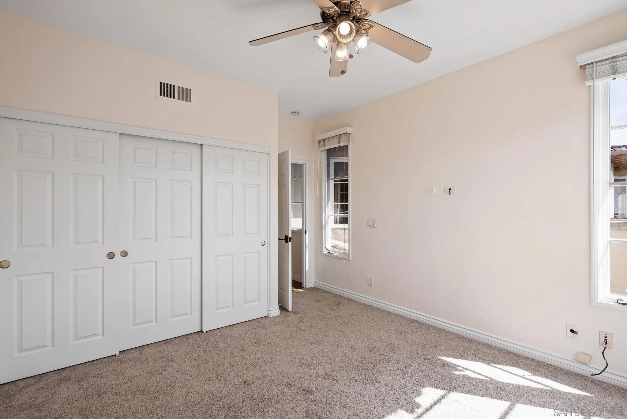 9683 Claiborne Square La Jolla, CA 92037 - Photo 46 of 67 a view of an empty room with a window