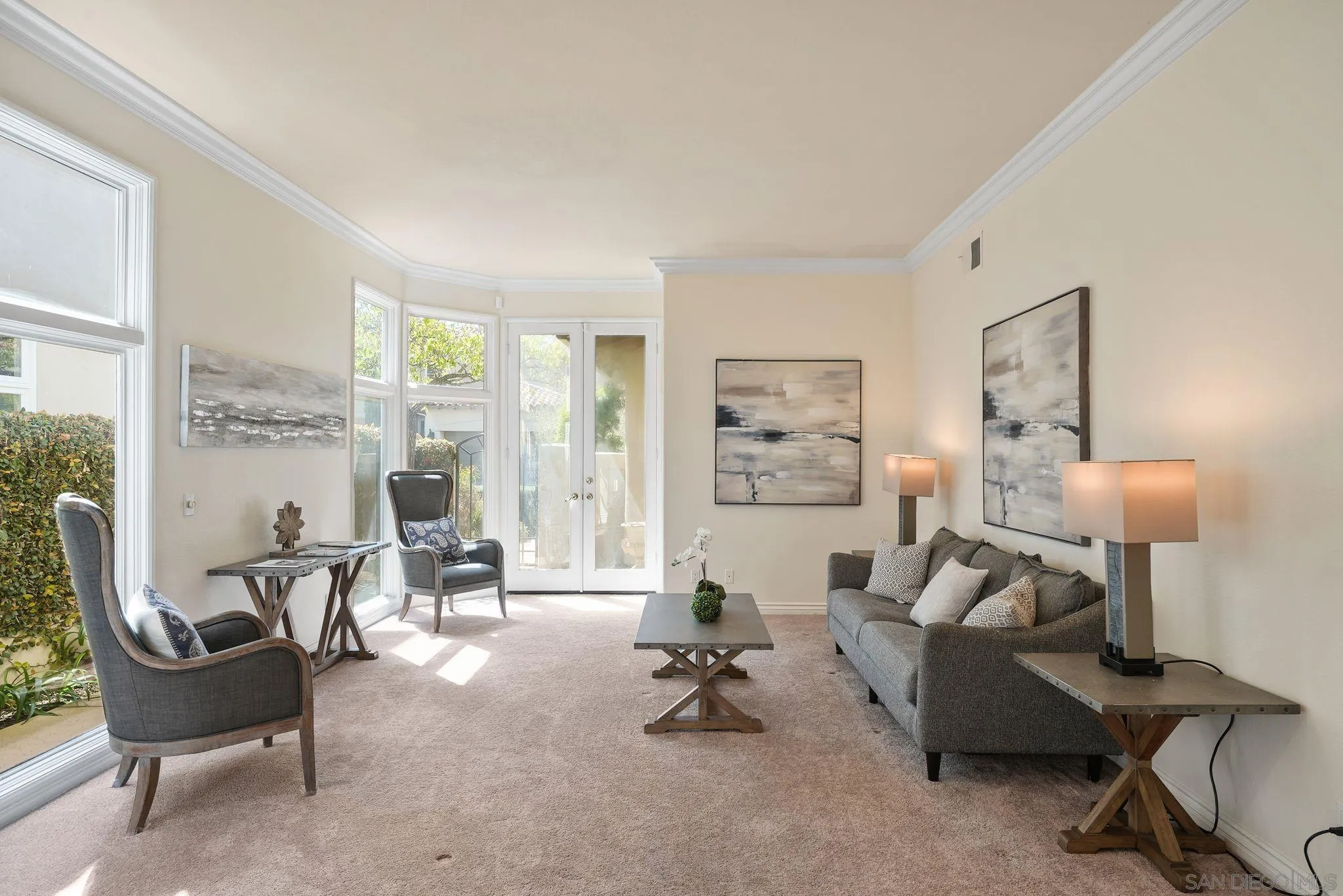 9683 Claiborne Square La Jolla, CA 92037 - Photo 7 of 67 a living room with furniture and a large window