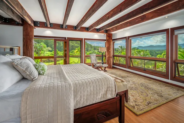 a bath tub sitting in a bathroom next to a window