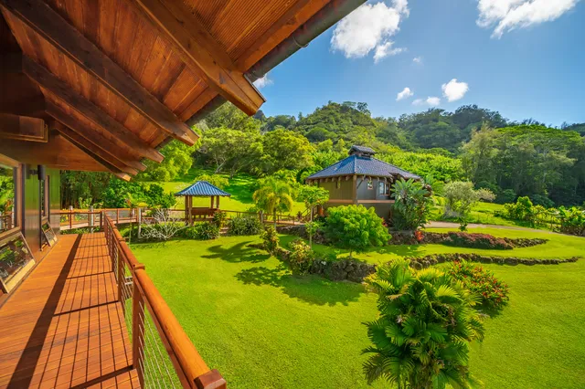 a view of balcony with wooden floor and outdoor seating