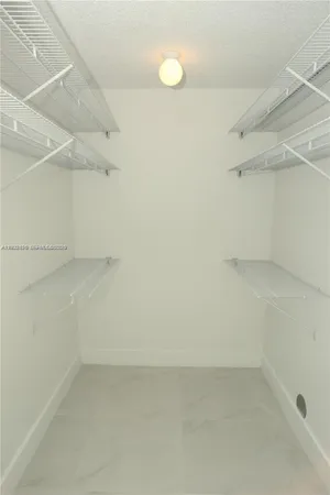 a view of a room with racks on the wall