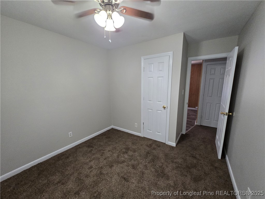 4617 Belford Road Fayetteville, NC 28314 - Photo 13 of 21 a view of an empty room with a chandelier fan