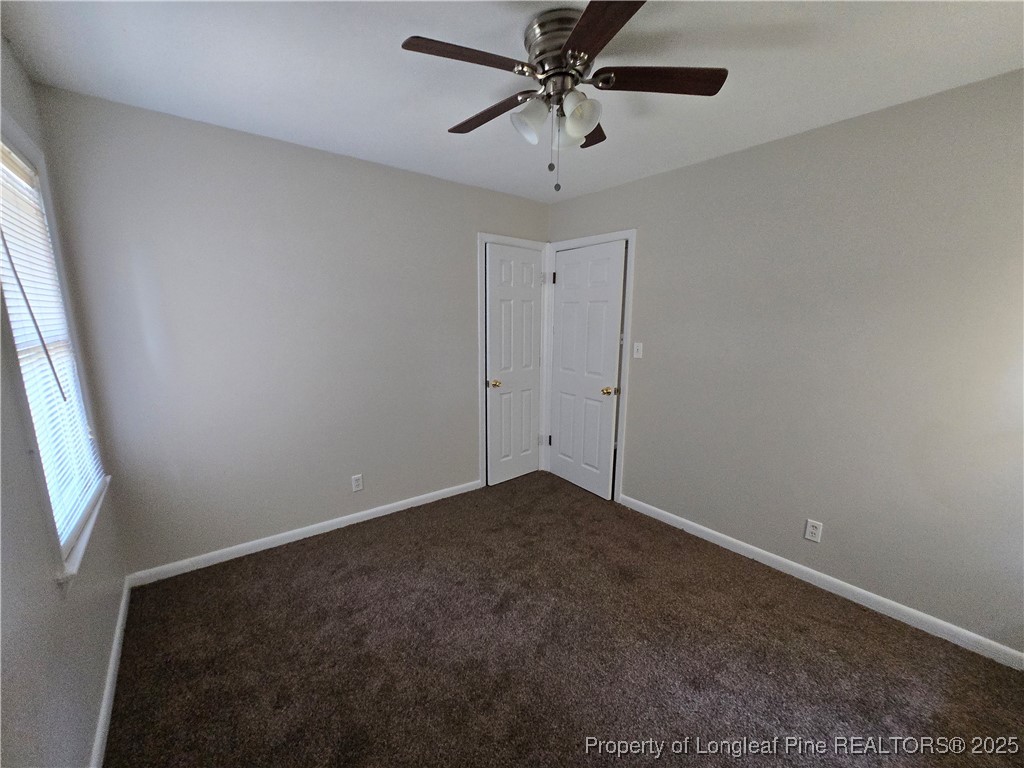 4617 Belford Road Fayetteville, NC 28314 - Photo 15 of 21 an empty room with windows and fan