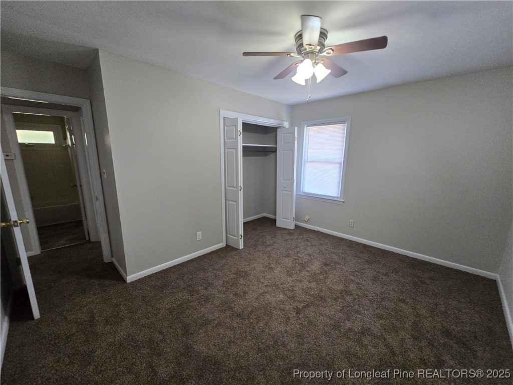 4617 Belford Road Fayetteville, NC 28314 - Photo 17 of 21 an empty room with closet and a ceiling fan