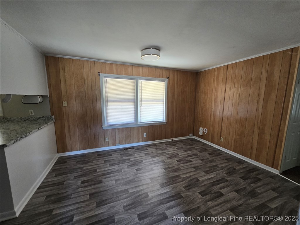 4617 Belford Road Fayetteville, NC 28314 - Photo 8 of 21 a view of an empty room with window and wooden floor