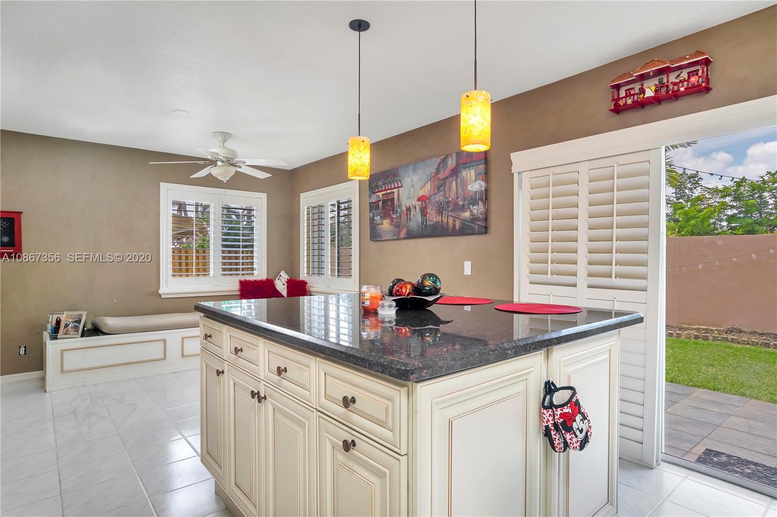 11360 Rockinghorse Road Cooper City, FL 33026 - Photo 15 of 31 a kitchen with a sink and a wooden floor