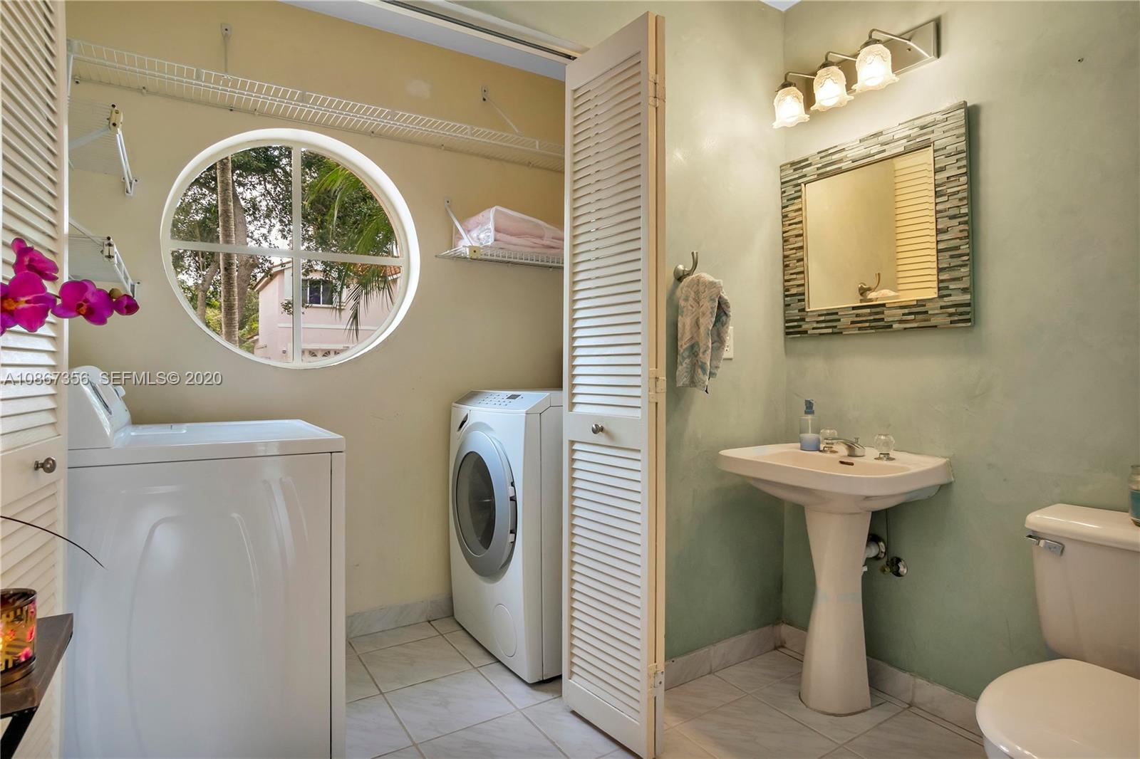 11360 Rockinghorse Road Cooper City, FL 33026 - Photo 16 of 31 a bathroom with a toilet sink and mirror