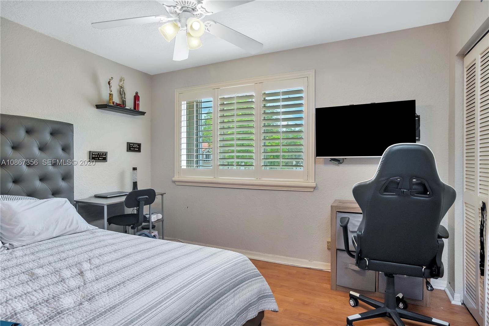 11360 Rockinghorse Road Cooper City, FL 33026 - Photo 21 of 31 a bedroom with a bed and a window