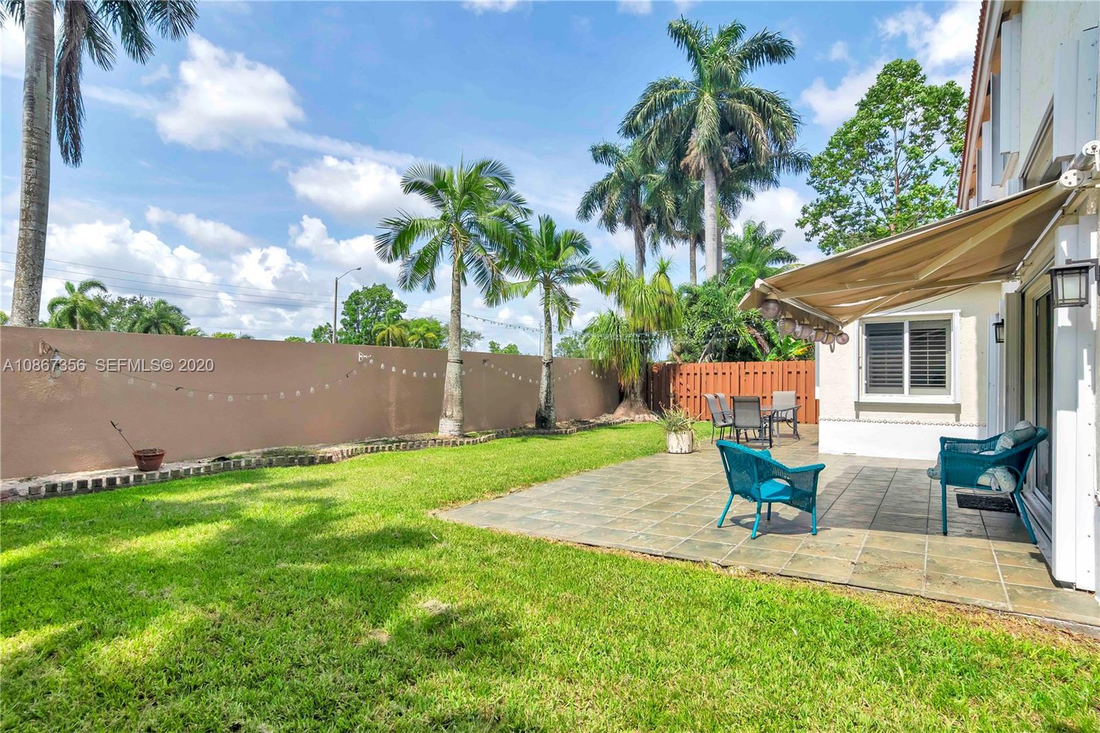 11360 Rockinghorse Road Cooper City, FL 33026 - Photo 26 of 31 a garden view with a seating space