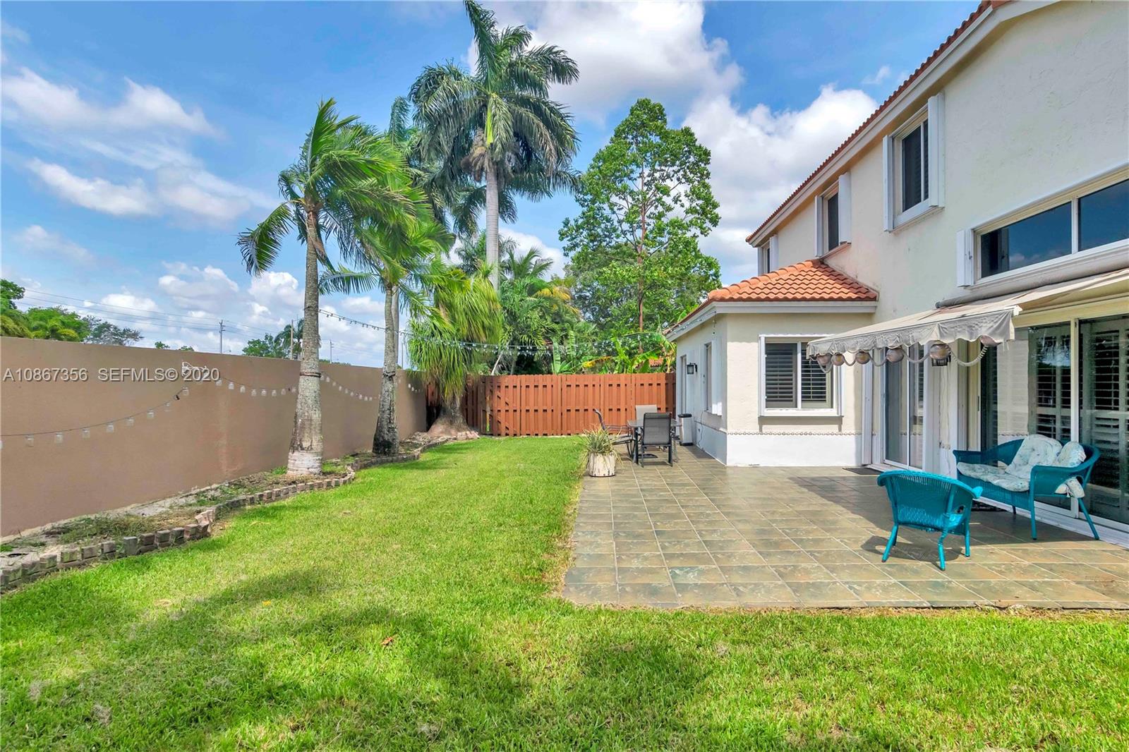 11360 Rockinghorse Road Cooper City, FL 33026 - Photo 27 of 31 front view of a house with a yard