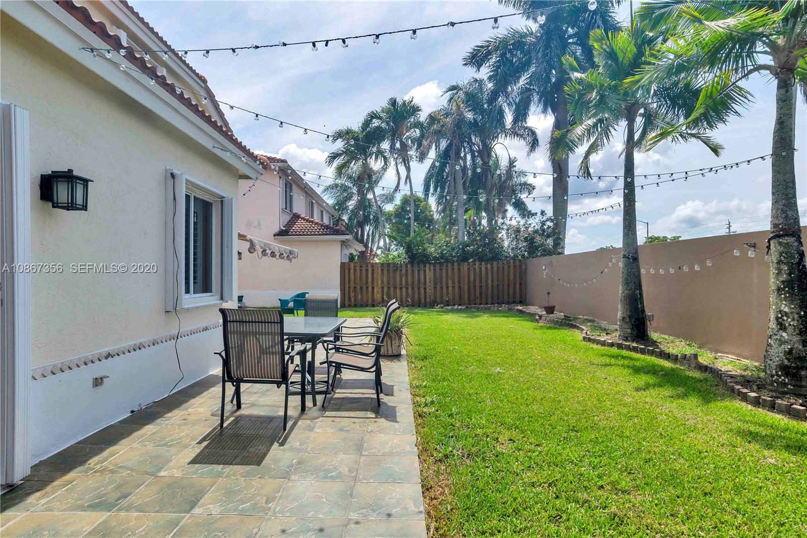 11360 Rockinghorse Road Cooper City, FL 33026 - Photo 31 of 31 a view of backyard with seating and green space