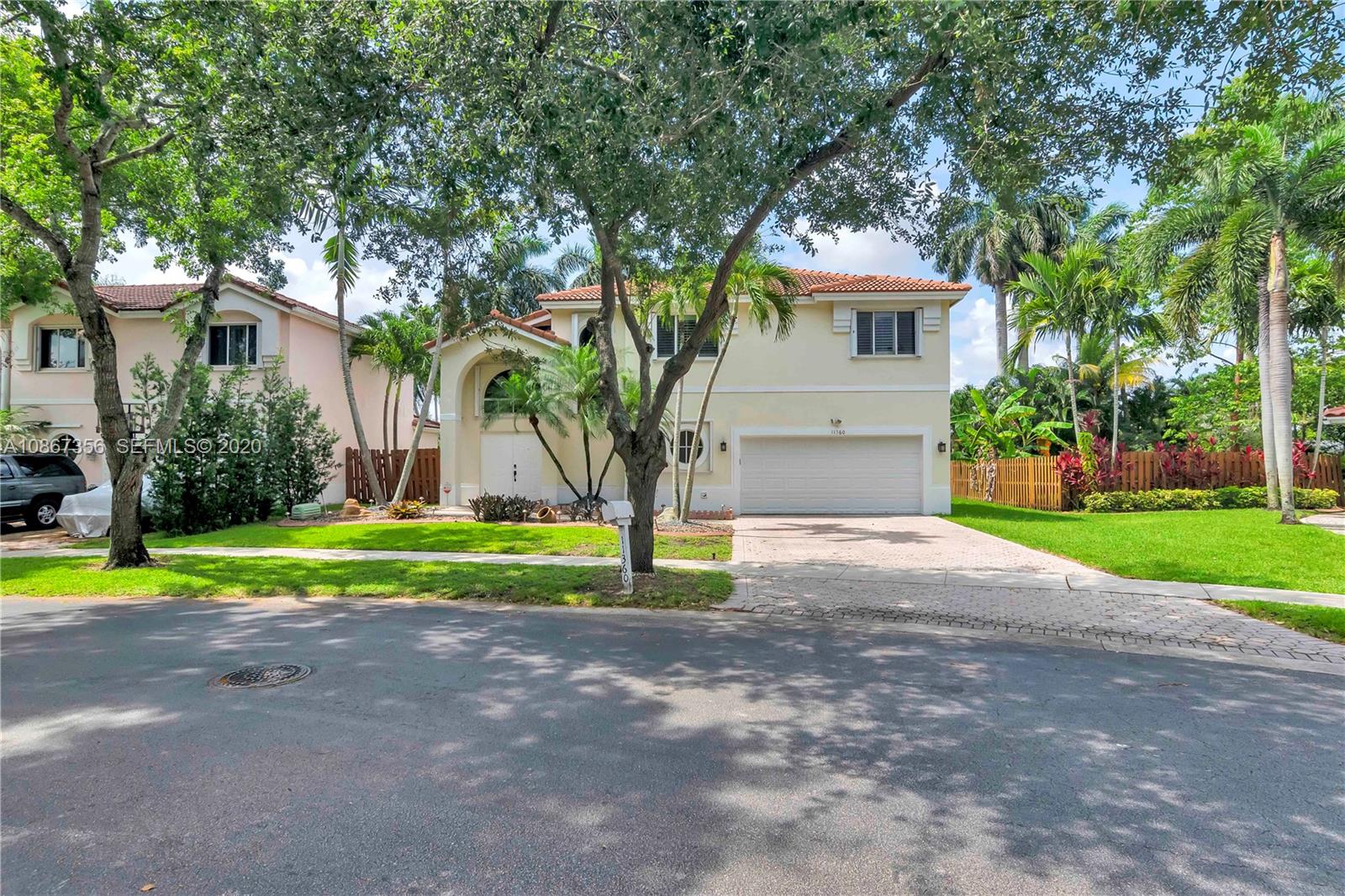 11360 Rockinghorse Road Cooper City, FL 33026 - Photo 4 of 31 a front view of house with yard and green space