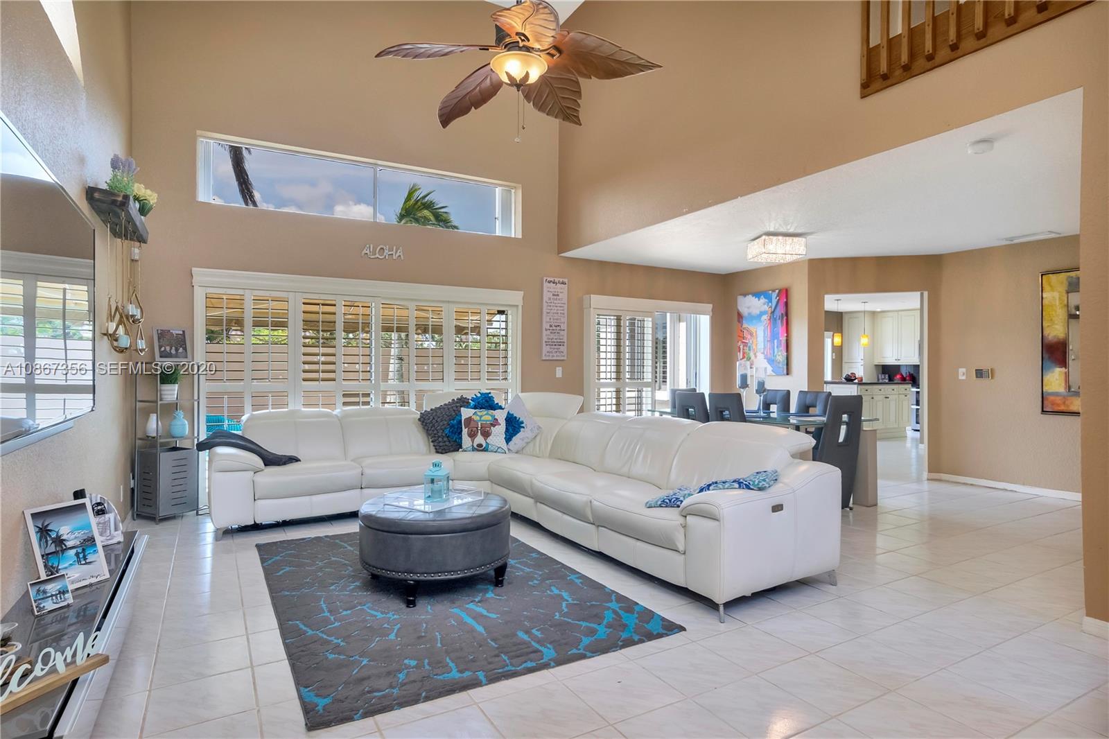 11360 Rockinghorse Road Cooper City, FL 33026 - Photo 6 of 31 a living room with furniture and a large window