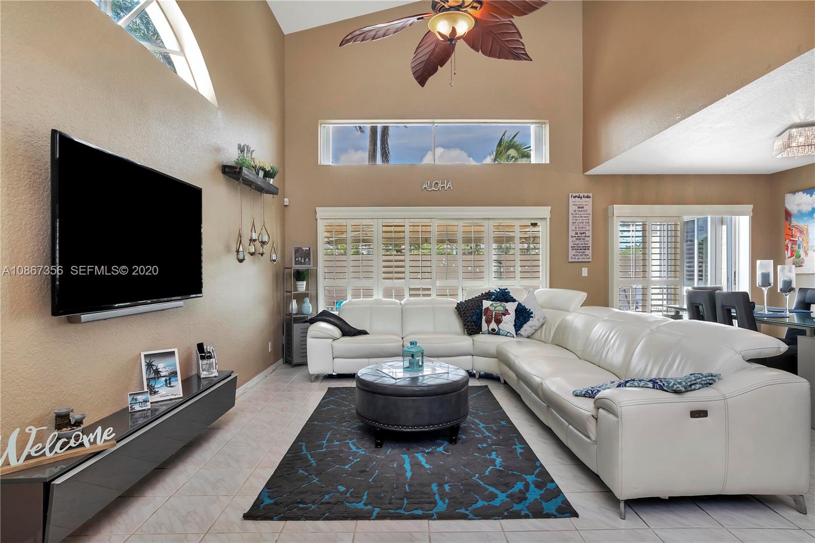 11360 Rockinghorse Road Cooper City, FL 33026 - Photo 7 of 31 a living room with furniture and a flat screen tv