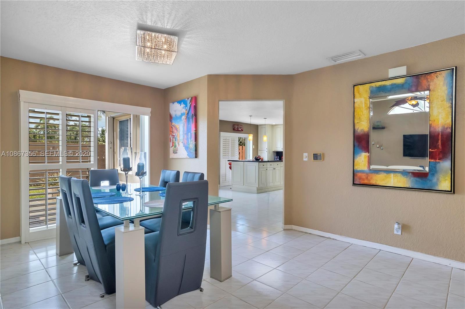 11360 Rockinghorse Road Cooper City, FL 33026 - Photo 9 of 31 a dining room with furniture and window