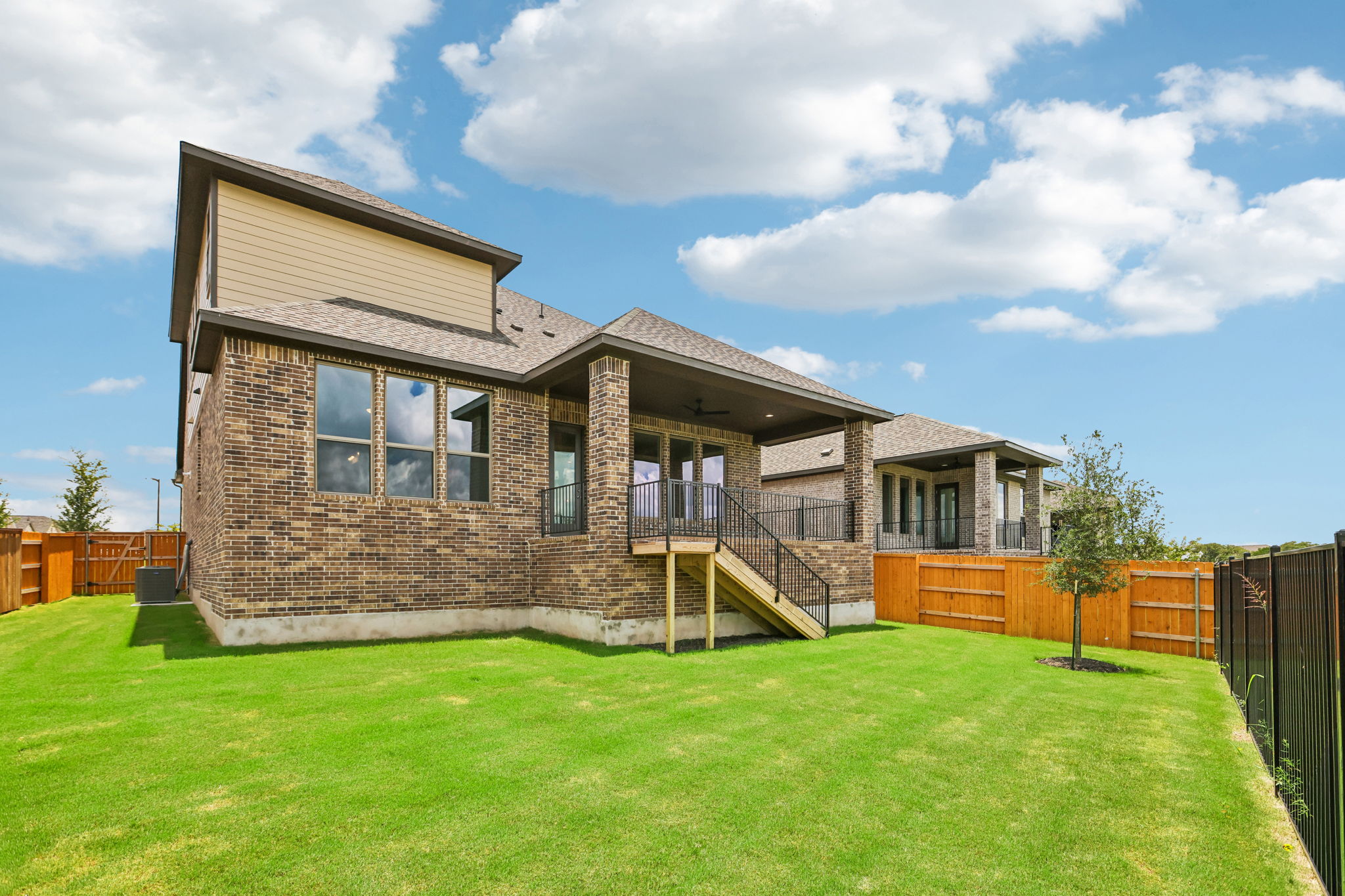 214 Prickly Poppy Loop Kyle, TX 78640 - Photo 35 of 38 a front view of a house with a yard