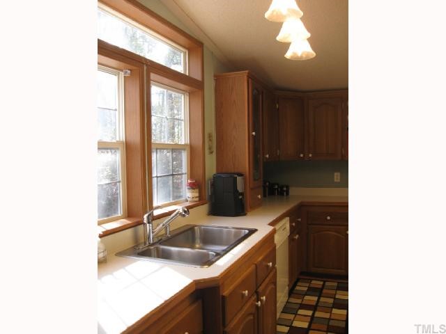 533 Powhatan Road Clayton, NC 27527 - Photo 4 of 12 Large windows at kitchen sink lets the sun flow in!!