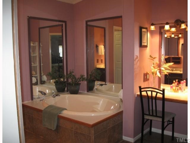 533 Powhatan Road Clayton, NC 27527 - Photo 7 of 12 Master BA has everything - here is the garden tub and her make up area!