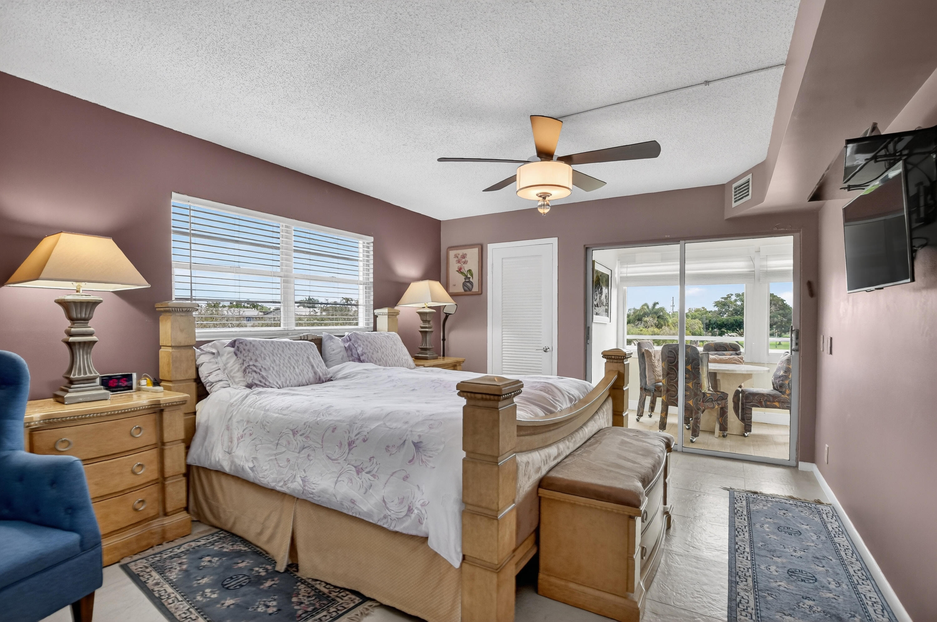 3080 Yarmouth C Boca Raton, FL 33434 - Photo 18 of 83 a bedroom with a bed and a chandelier