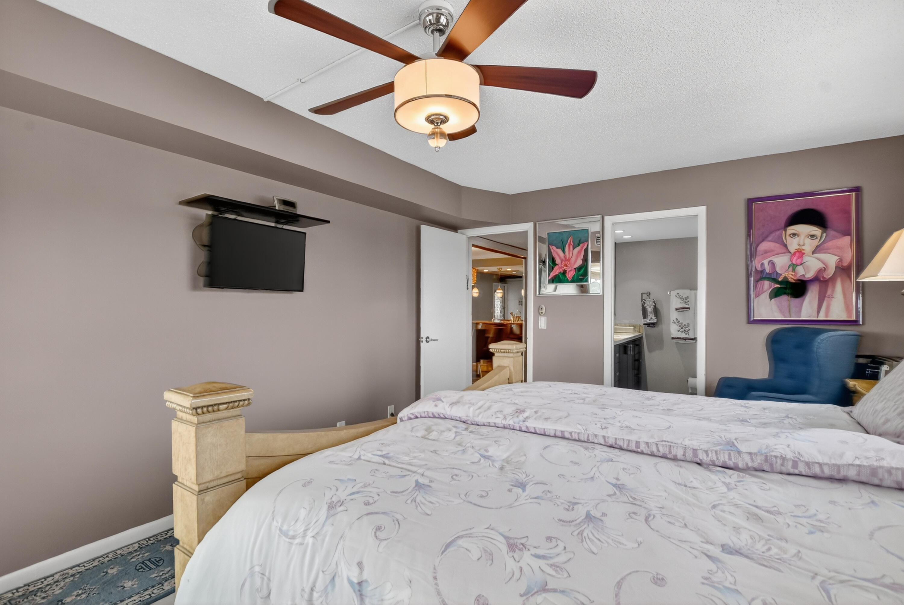 3080 Yarmouth C Boca Raton, FL 33434 - Photo 19 of 83 a bedroom with a bed and a chandelier