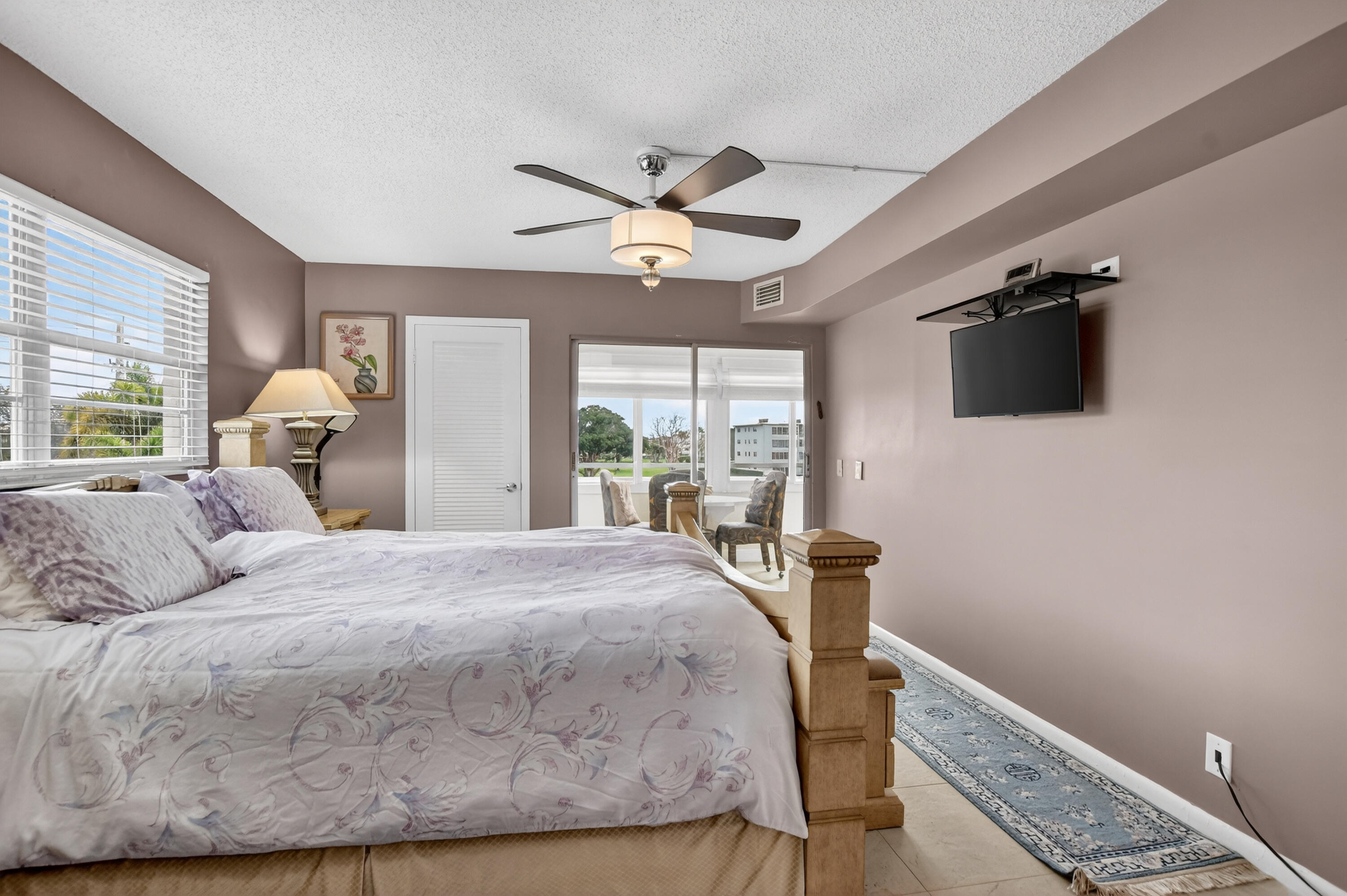 3080 Yarmouth C Boca Raton, FL 33434 - Photo 21 of 83 a bedroom with a bed and a chandelier