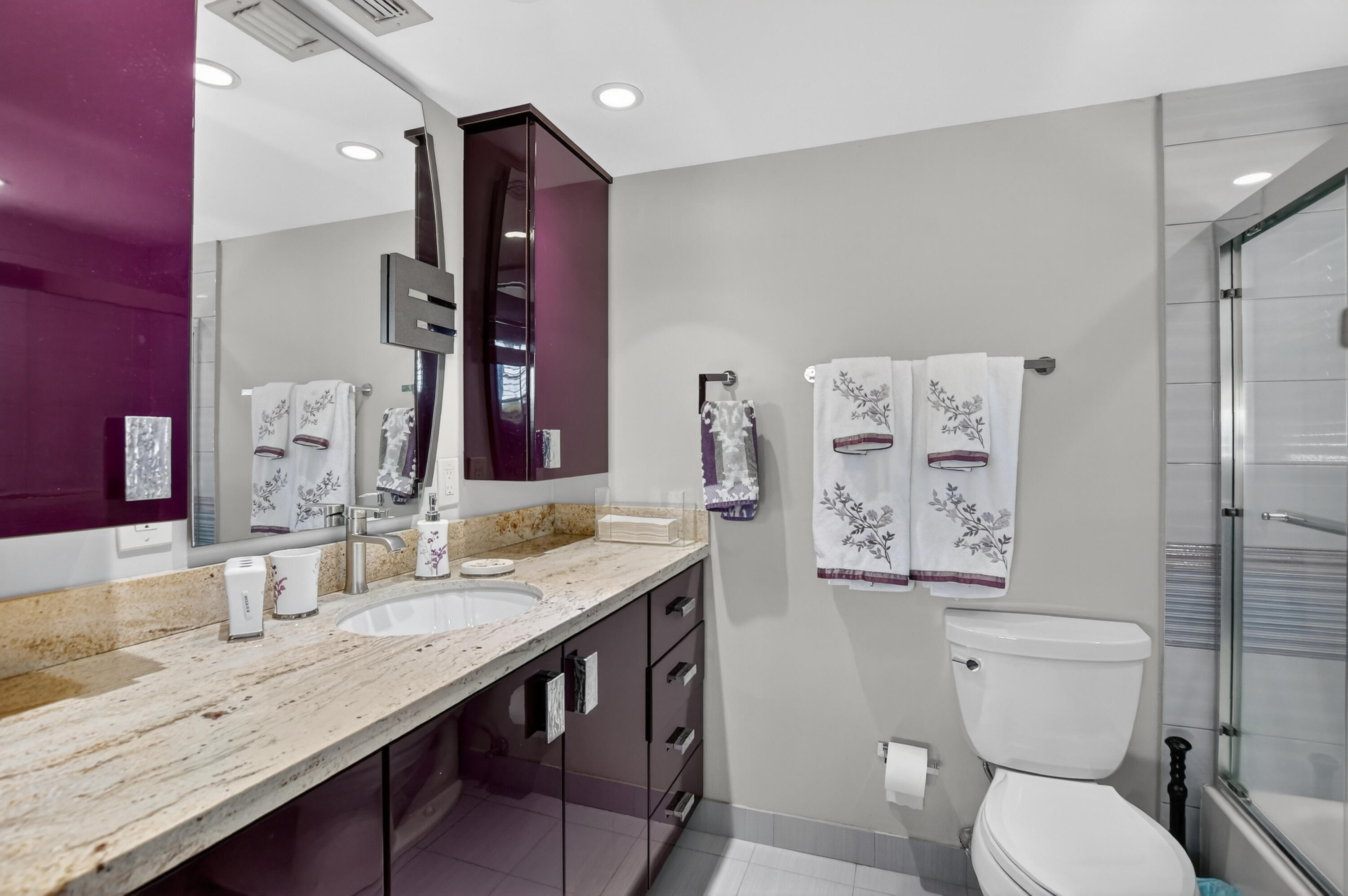 3080 Yarmouth C Boca Raton, FL 33434 - Photo 22 of 83 a bathroom with a granite countertop toilet sink and mirror