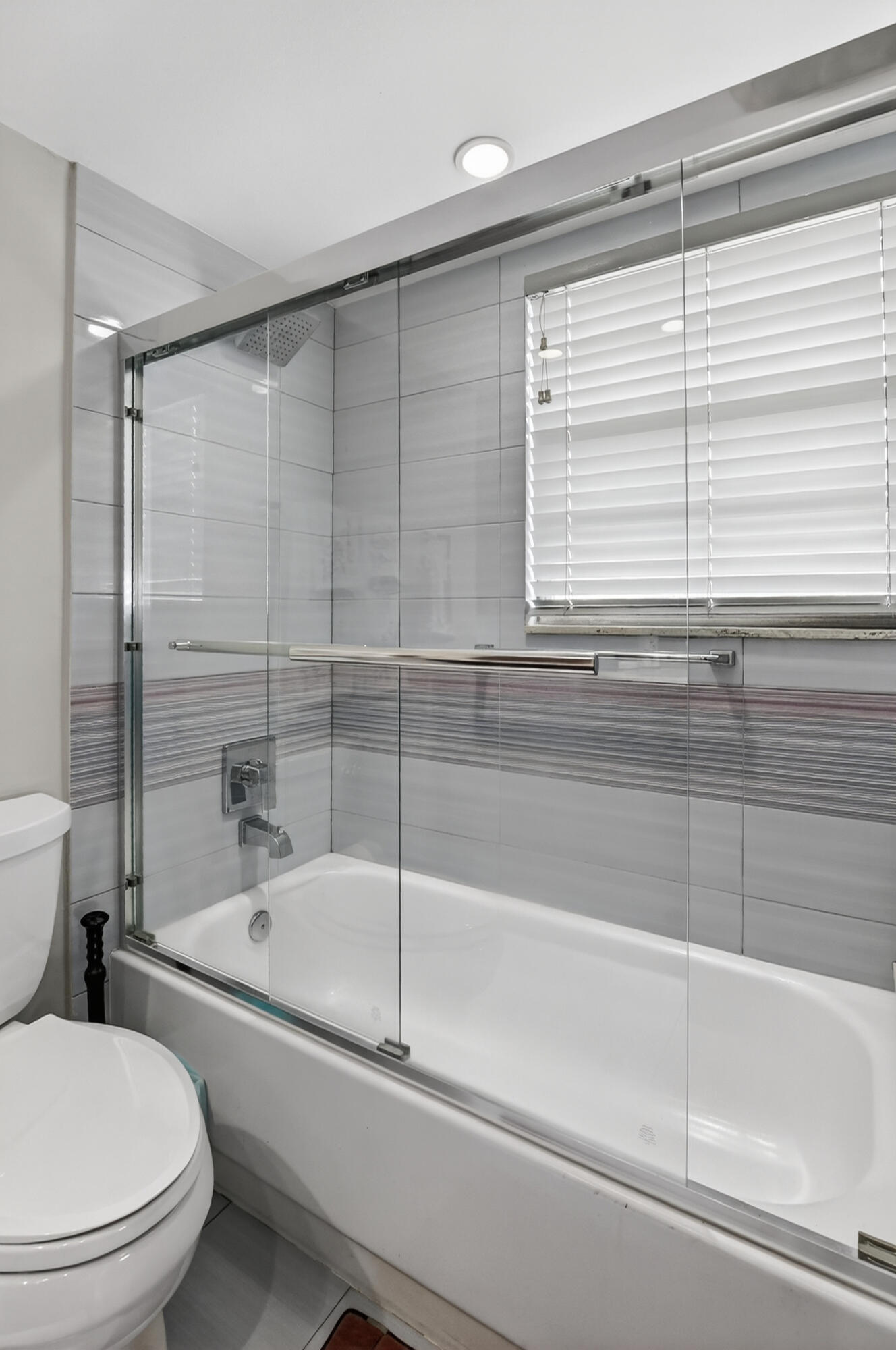 3080 Yarmouth C Boca Raton, FL 33434 - Photo 24 of 83 a bathroom with a shower and a toilet