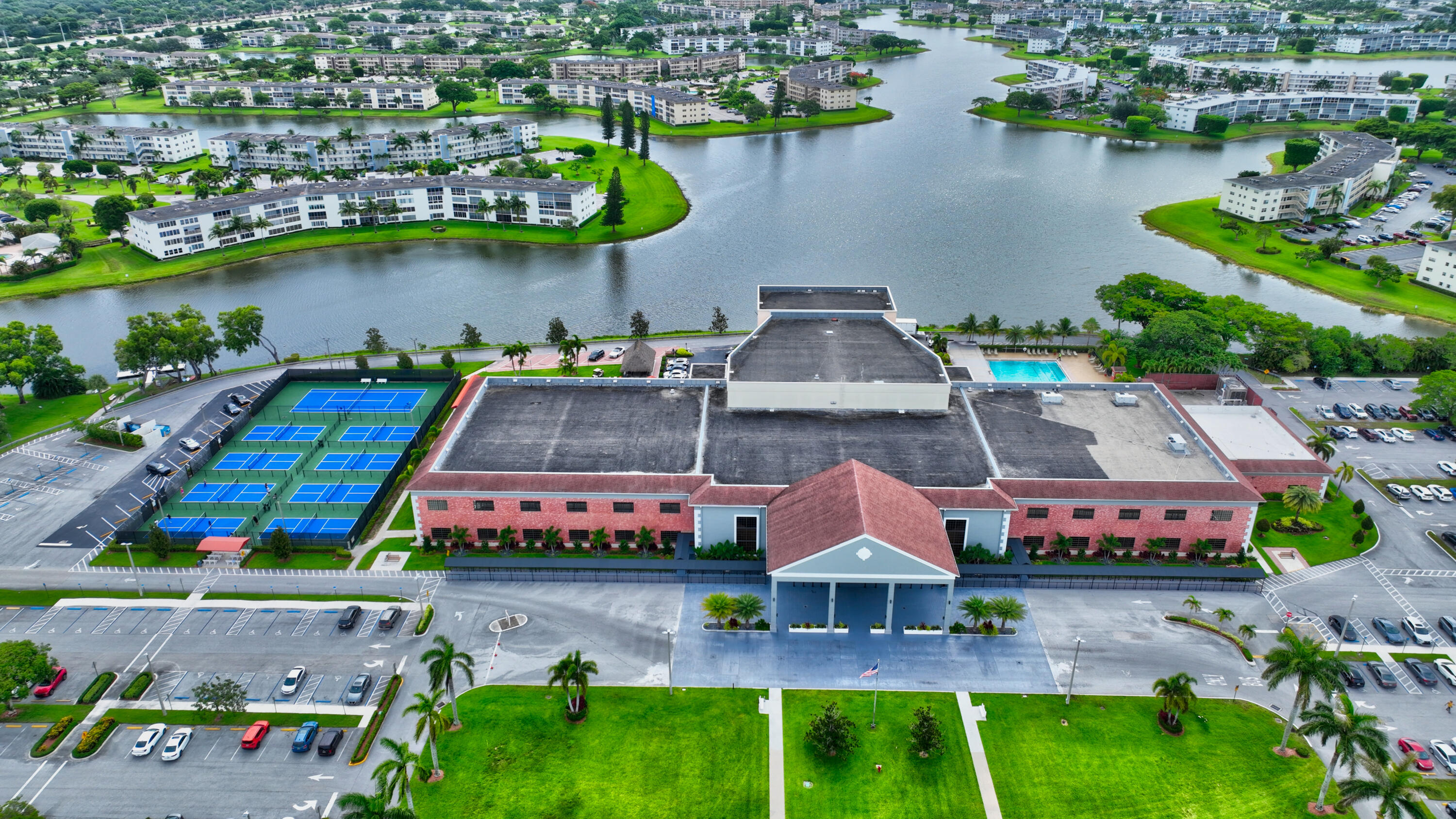 3080 Yarmouth C Boca Raton, FL 33434 - Photo 71 of 83 an aerial view of a house with a garden and lake view