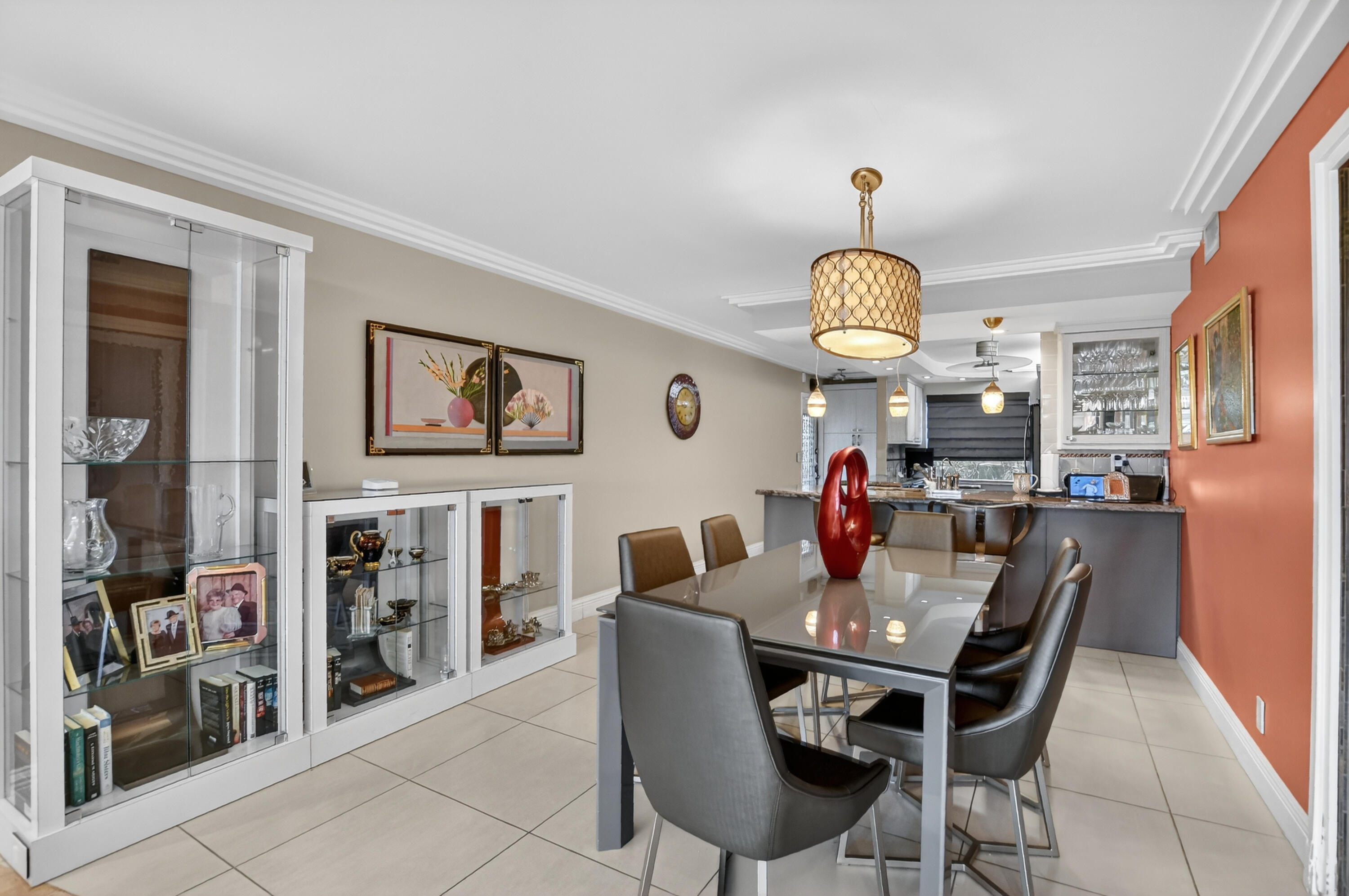 3080 Yarmouth C Boca Raton, FL 33434 - Photo 9 of 83 a dining room with furniture a chandelier and a rug