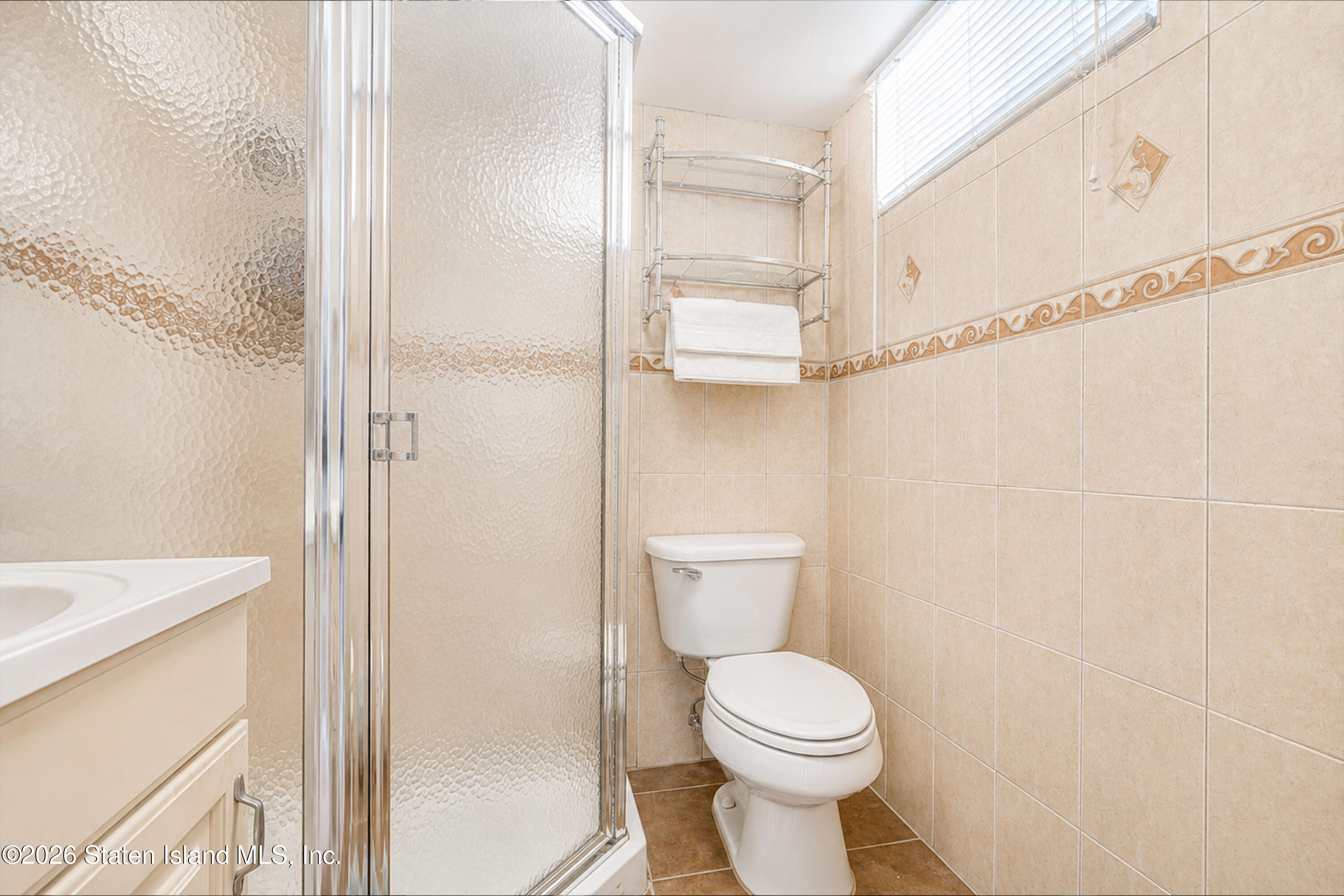 37 Middle Loop Road Staten Island, NY 10308 - Photo 33 of 38 a bathroom with a toilet and a shower
