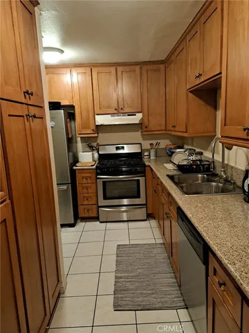 a view of bathroom with a sink and mirror