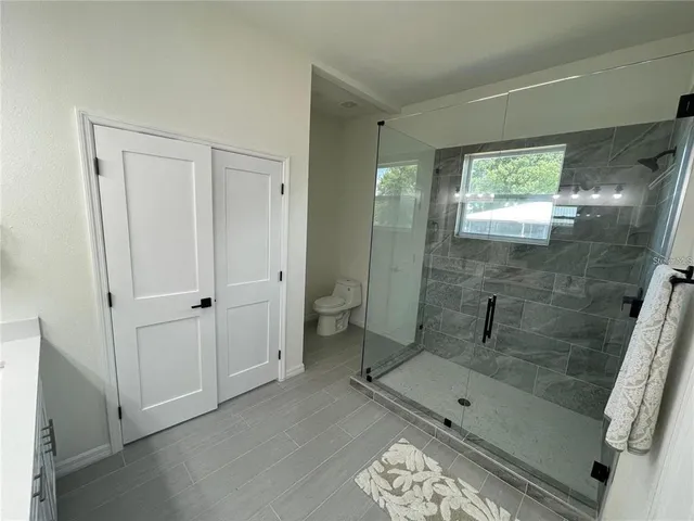 a bathroom with a bathtub and a shower