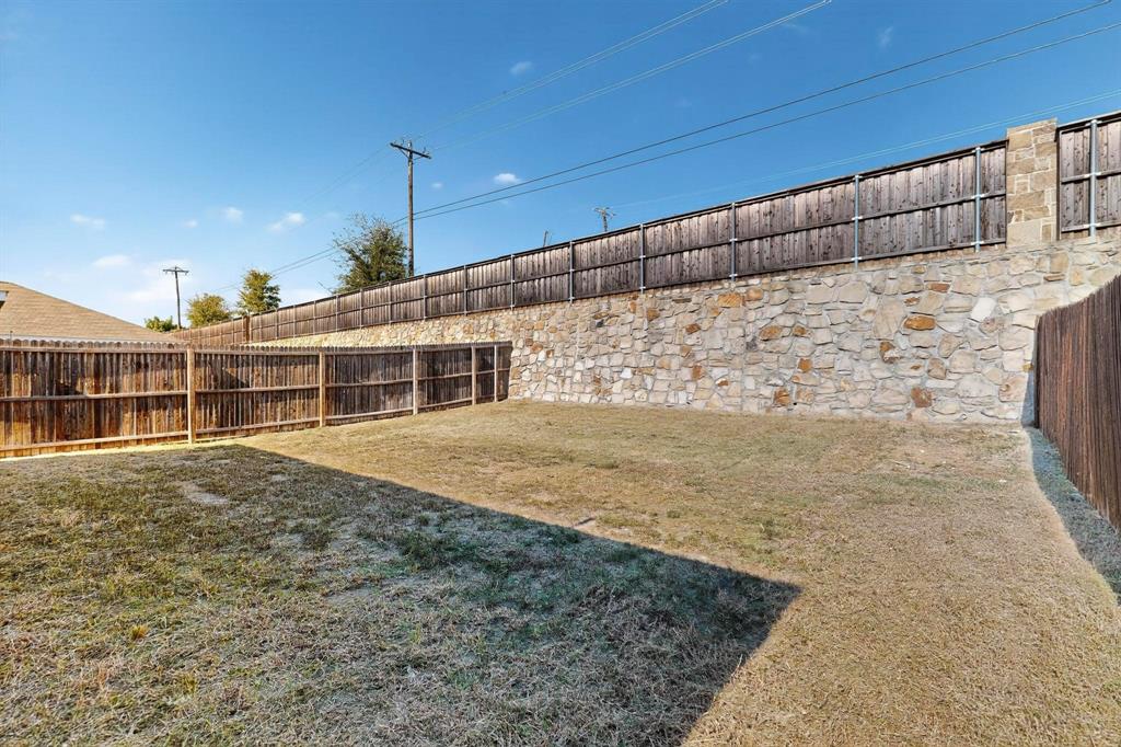 5516 McClelland Street Forney, TX 75126 - Photo 34 of 36 View of fenced backyard